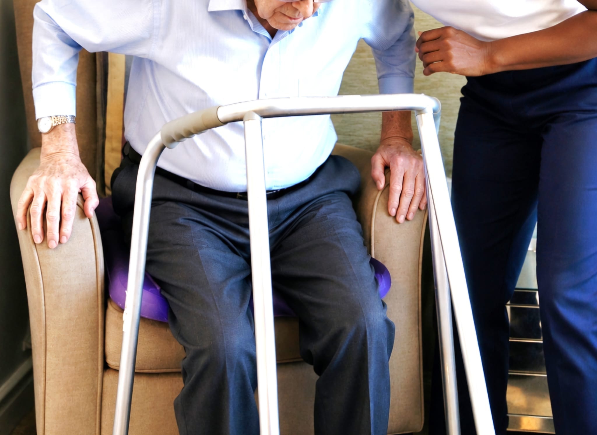 Patient recovering from hip or knee surgery with physiotherapy support